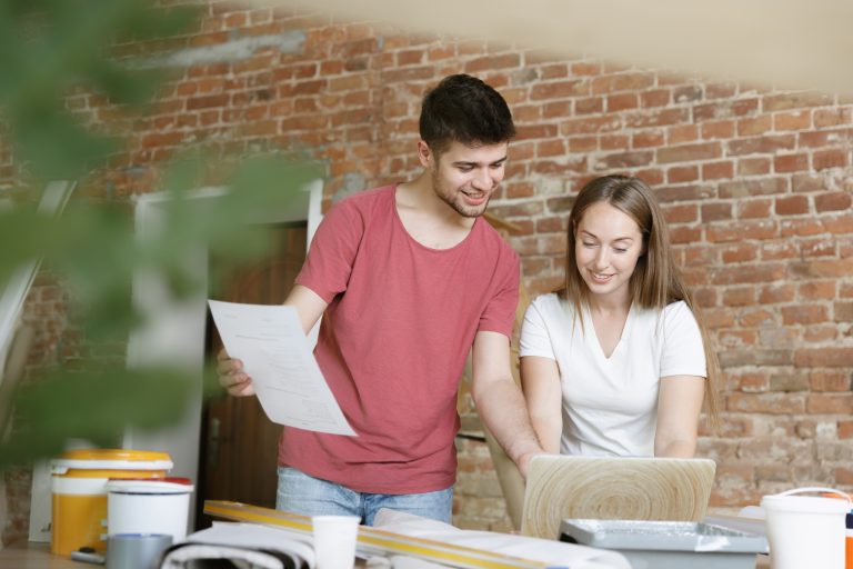 Young couple doing apartment repair together themselves